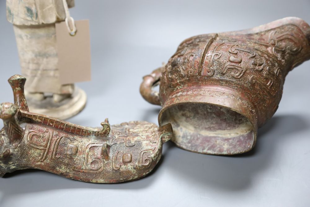 A Chinese archaistic bronze vessel, a Chinese carved wood figure and a cinnabar lacquer mount